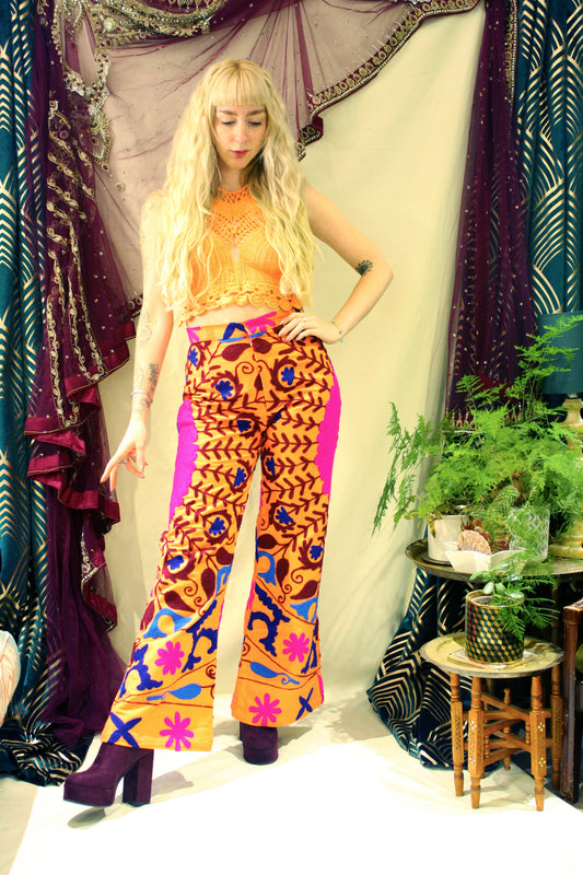 Bohemian 70s retro high waisted cotton flares orange colour with bright floral embroidery available in various sizes. 
