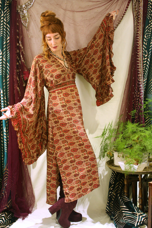 Bohemian silk 70's maxi dress, side slits, v neck, dramatic flared sleeves, adjustable waist bank, in a burgundy paisley Indian silk.  